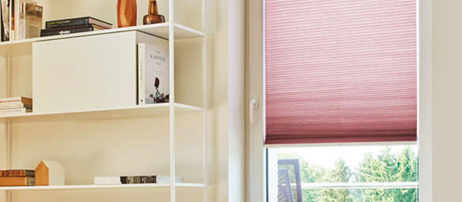Pink Duette blind brightening up a neutral room decor